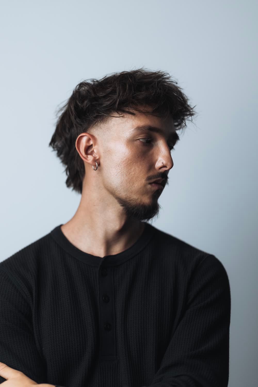 Studio portrait of Dylan Schiumarini on a light backdrop
